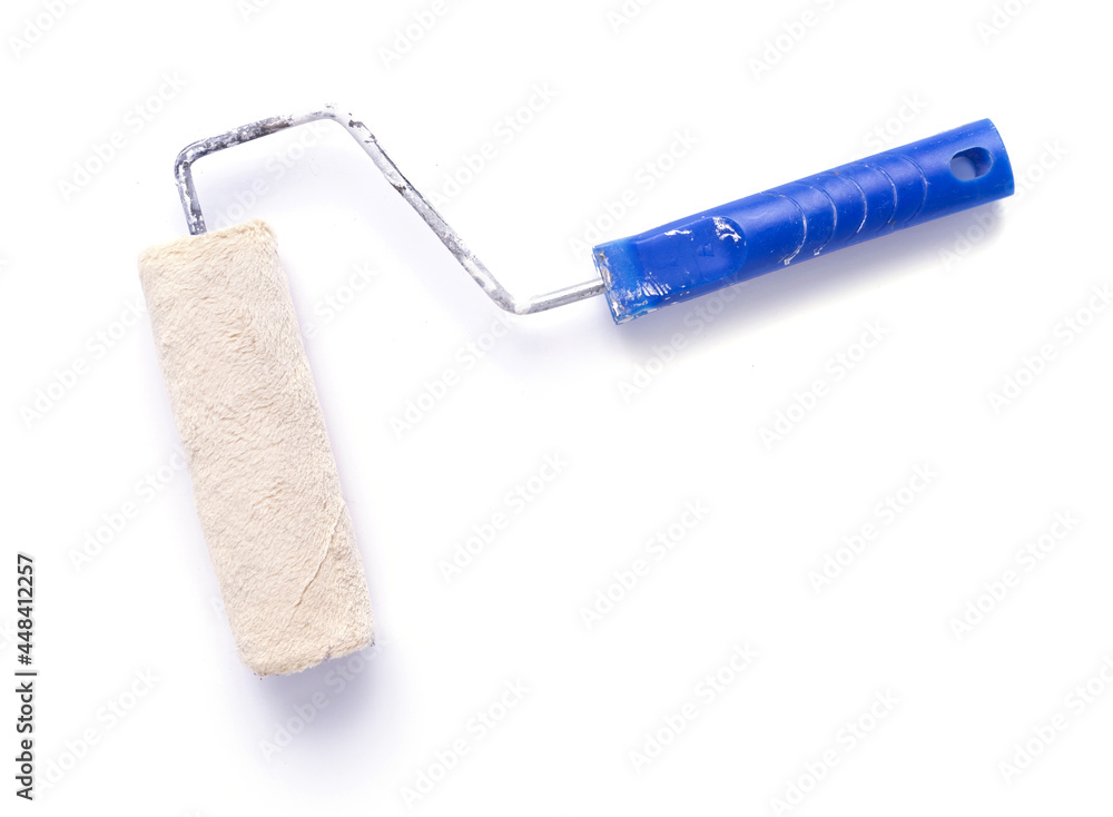 Old paint roller tool isolated on white background Old paint roller tool isolated on white background