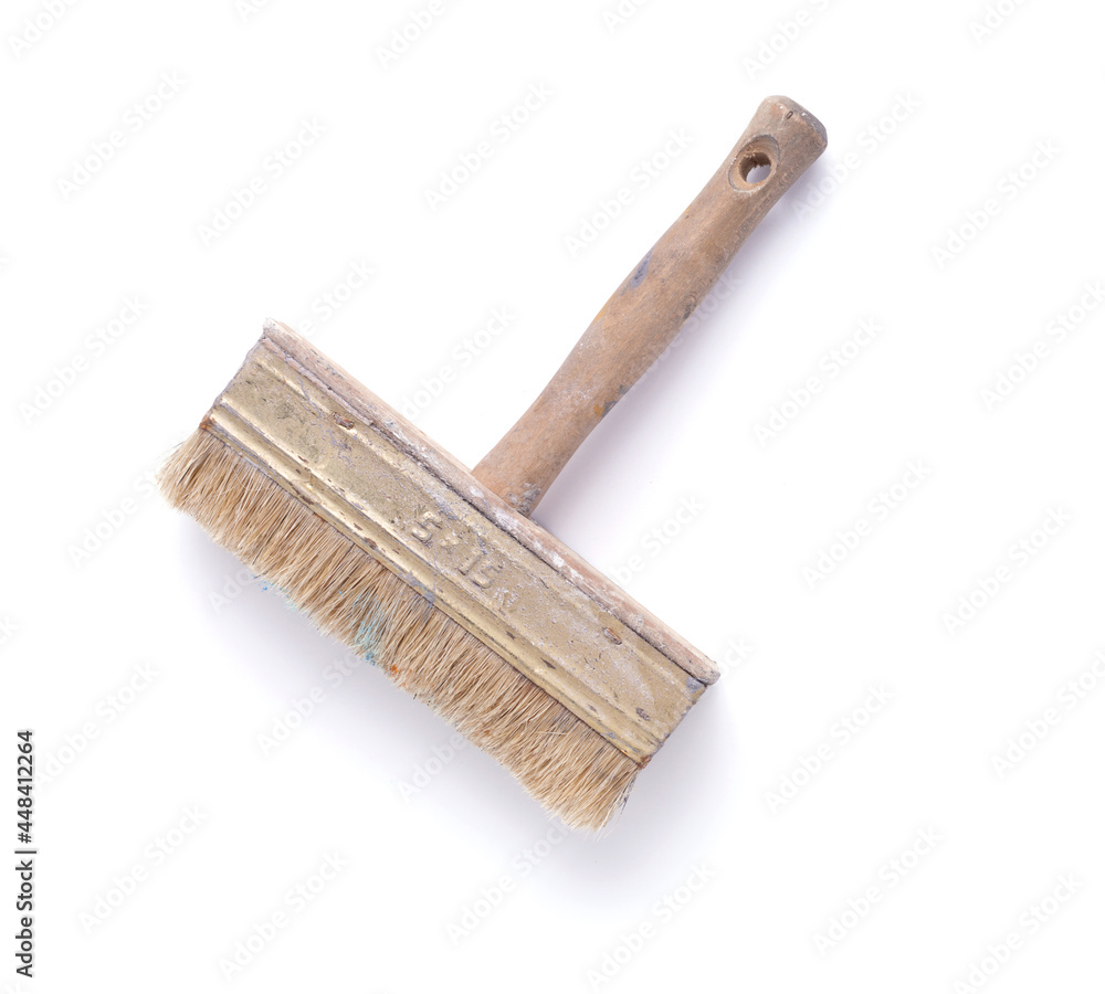 Old used paintbrush tool isolated on white background. Construction pint brush Old used paintbrush tool isolated on white background. Construction pint brush