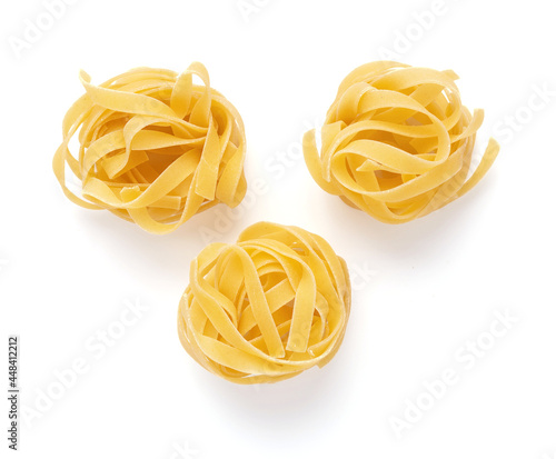 Pasta tagliatelle isolated on white background. Raw pasta italian food photo