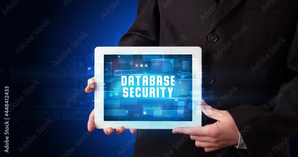 Person holding tablet, security concept Person holding tablet, security concept