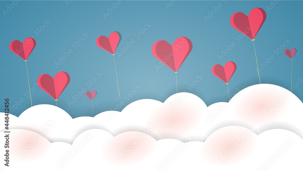 Several red paper hearts tied with strings floated above the white clouds and blue sky.
