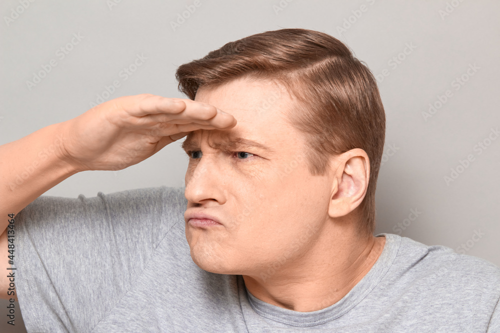 Portrait of funny serious focused mature man gazing into the distance Portrait of funny serious focused mature man gazing into the distance
