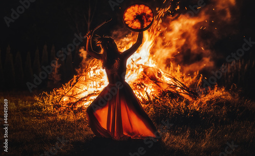 Fotografie, Obraz beautiful shamanic girl playing on shaman frame drum in the nature