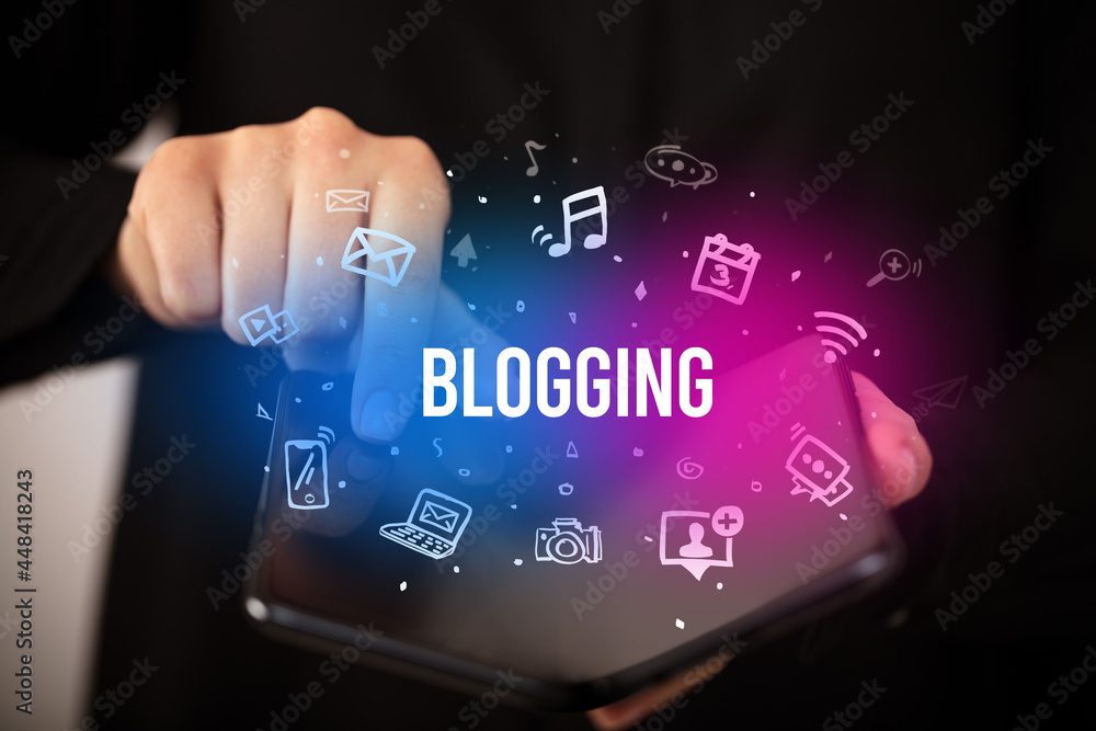 Businessman holding a foldable smartphone, social media concept Businessman holding a foldable smartphone, social media concept