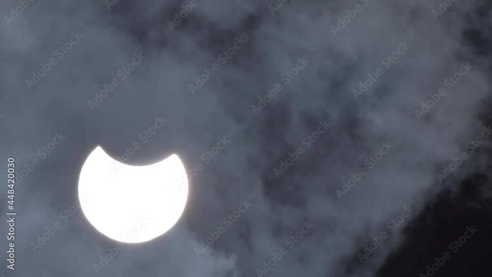 Eclipse of the moon behind the clouds dramatic movie. Cinematic blurred environment. Hot air vibrates for an eclipse of the moon. The clouds cover the moon Eclipse of the moon behind the clouds dramatic movie. Cinematic blurred environment. Hot air vibrates for an eclipse of the moon. The clouds cover the moon