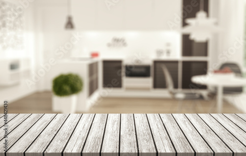 Blurred background of kitchen and white wooden desk.