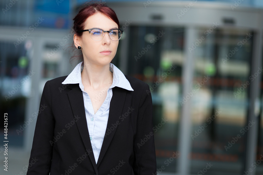 Confident young female manager outdoor in a modern urban setting Confident young female manager outdoor in a modern urban setting
