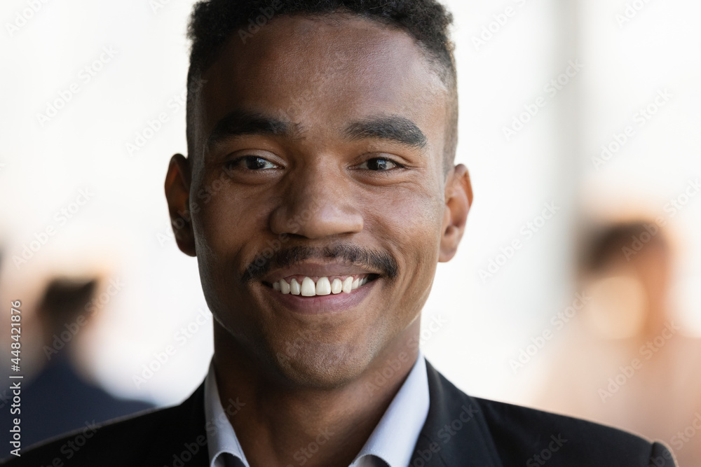 Close up head shot facial portrait of smiling young 30s african american businessman employee worker. Happy mixed race biracial ceo executive manager looking at camera, successful career concept. Close up head shot facial portrait of smiling young 30s african american businessman employee worker. Happy mixed race biracial ceo executive manager looking at camera, successful career concept.