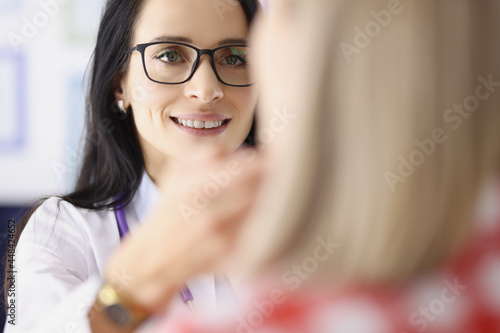 Fototapeta Naklejka Na Ścianę i Meble -  Adult woman at doctor appointment who problems with thyroid gland and endcrine system