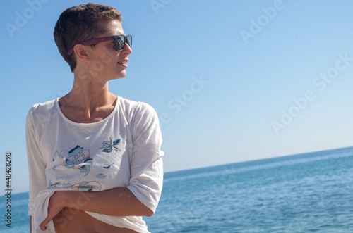 Woman posing on the beach.