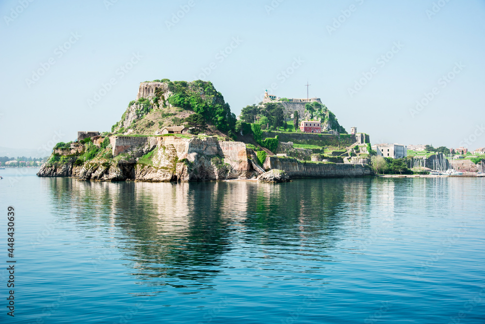 View of the fortress of Corfu from the sea in the morning mist with a steamer in the distance, Greece. Harmony, popular tourist attractions. amazing places.