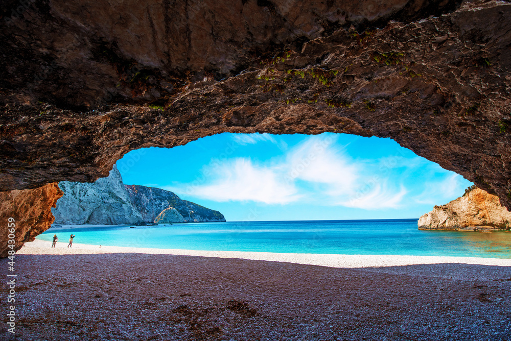 Fascinating landscape through the cliffs on the Porto Katsiki Beach on the island of Lefkada, Greece. View from the cave. Amazing places. Tourist Attractions.