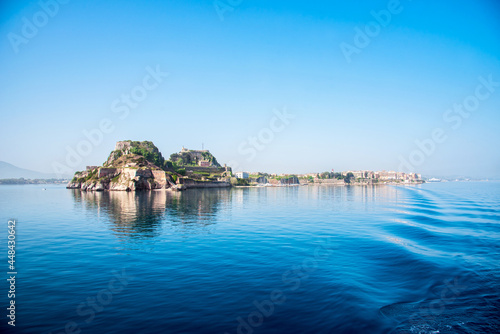 Obraz na płótnie View of the fortress of Corfu from the sea in the morning mist with a trace of waves from the ferry. popular tourist attractions. amazing places. w salonie