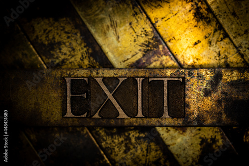 Exit text message on textured grunge copper and vintage gold background