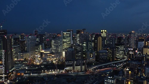 Wallpaper Mural UMEDA, OSAKA, JAPAN : Aerial high angle sunrise view of CITYSCAPE of OSAKA. View of buildings and street around Osaka and Umeda station. Wide view time lapse shot, night to morning. Torontodigital.ca