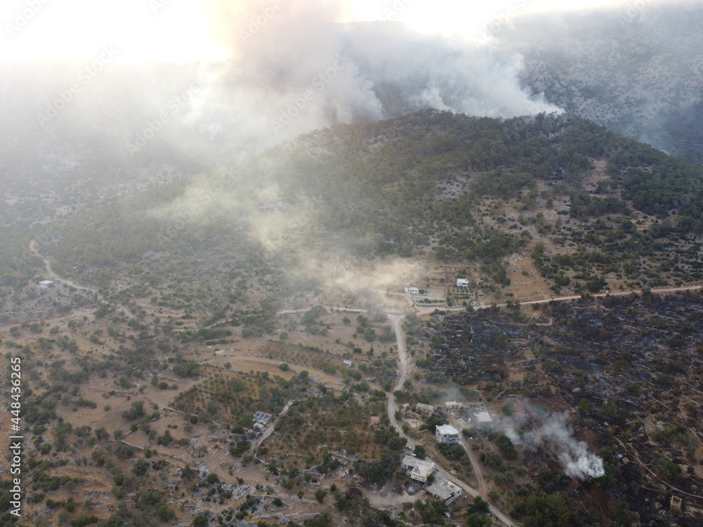 Summer forest fires. Smoke of a forest fire in the valley near Bogsak, Mersin province, Turkey. Natural disasters. Aerial view
