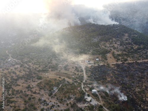 Summer forest fires. Smoke of a forest fire in the valley near Bogsak, Mersin province, Turkey. Natural disasters. Aerial view © Philipp Berezhnoy