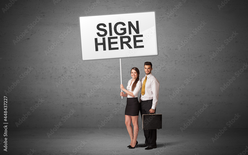 business person holding a traffic sign business person holding a traffic sign