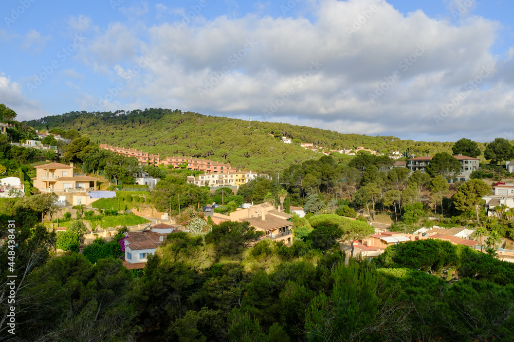 Green summer mountain landscape with many small summer houses in Begur, Catalonia