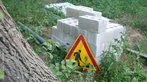 Triangular road sign go construction work. 