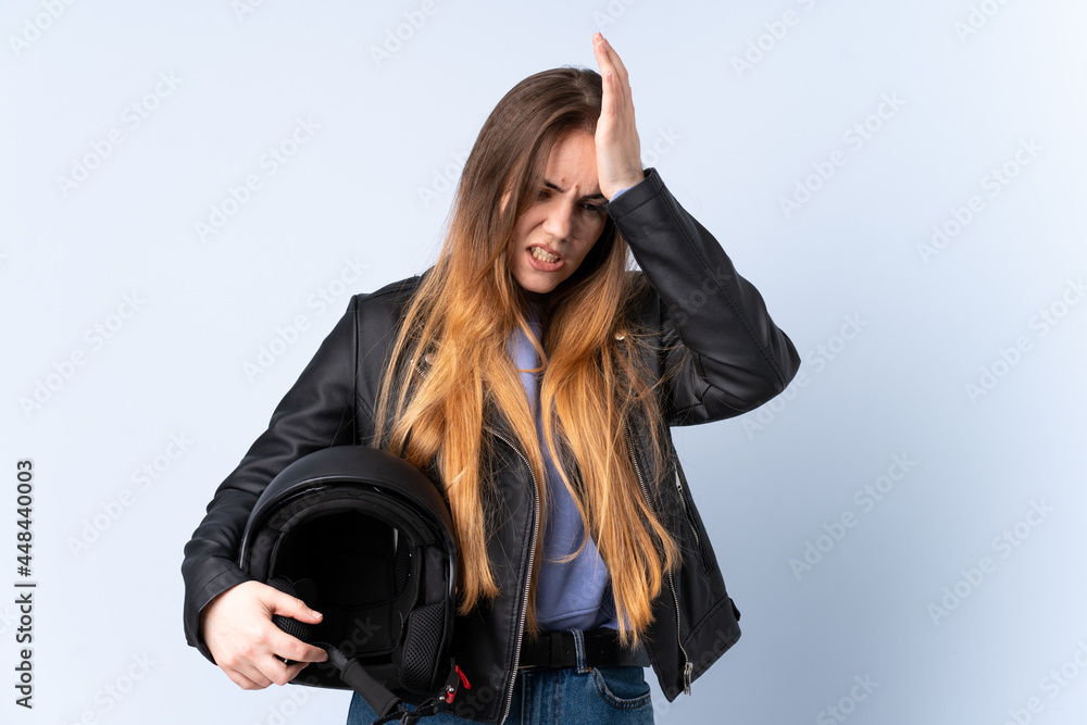 Woman with a motorcycle helmet having doubts with confuse face expression Woman with a motorcycle helmet having doubts with confuse face expression