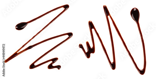Photos Chocolate syrup drizzle isolated on white background