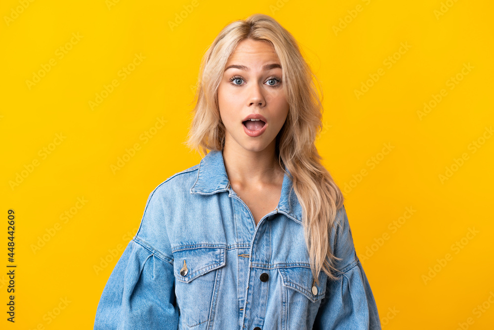 Young Russian woman isolated on yellow background with surprise facial expression Young Russian woman isolated on yellow background with surprise facial expression