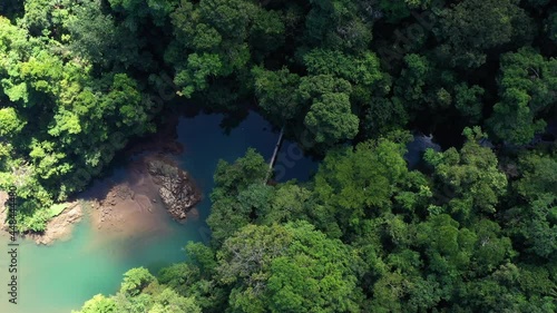Suspension bridge over rio agujitas Drake aerial top shot river and rainforest  photo