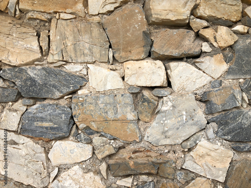 Old ancient wall with different stones as abstract background Old ancient wall with different stones as abstract background