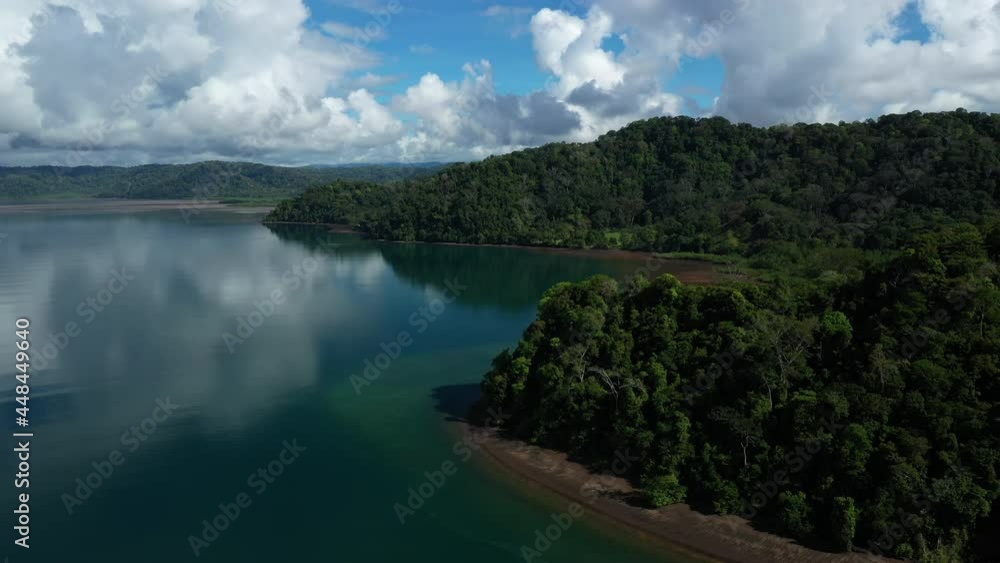 deep tropical lowland wet forest by the ocean calm water of Golfo Dulce Costa Rica aerial sunny day deep tropical lowland wet forest by the ocean calm water of Golfo Dulce Costa Rica aerial sunny day