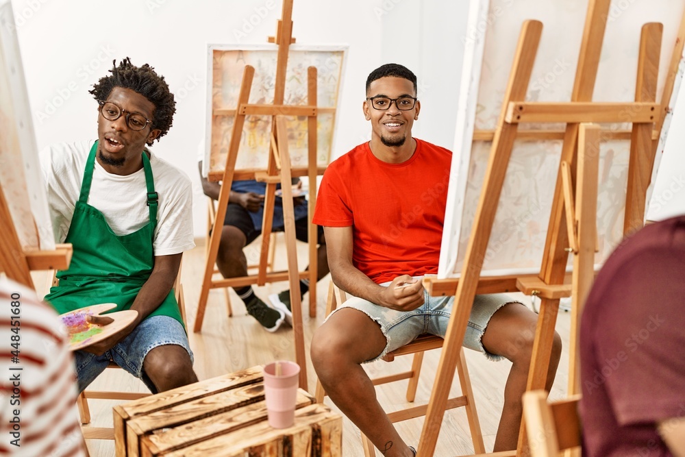 Group of young african american artist man smiling happy drawing at art studio.