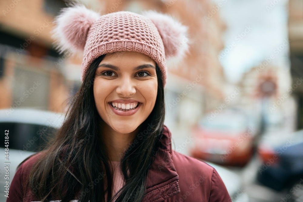 Young hispanic girl smiling happy standing at the city. Young hispanic girl smiling happy standing at the city.