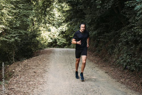 Wallpaper Mural Young man running outdoors in the nature Torontodigital.ca