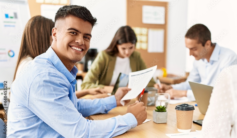 Group of business workers smiling happy working at the office. Group of business workers smiling happy working at the office.