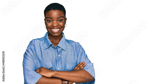 Young african american woman wearing casual clothes happy face smiling with crossed arms looking at the camera. positive person.