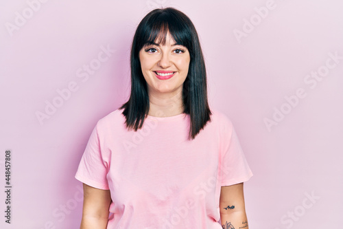 Young hispanic woman wearing casual clothes with a happy and cool smile on face. lucky person. © Krakenimages.com