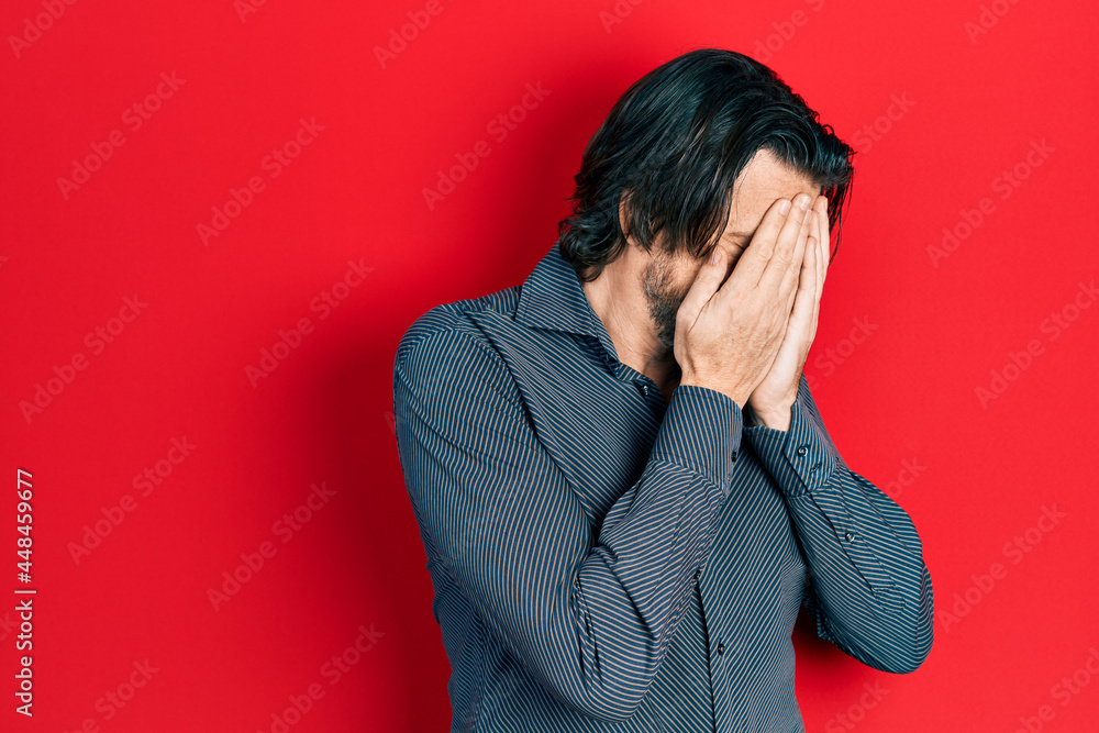 Middle age caucasian man wearing casual clothes with sad expression covering face with hands while crying. depression concept. Middle age caucasian man wearing casual clothes with sad expression covering face with hands while crying. depression concept.
