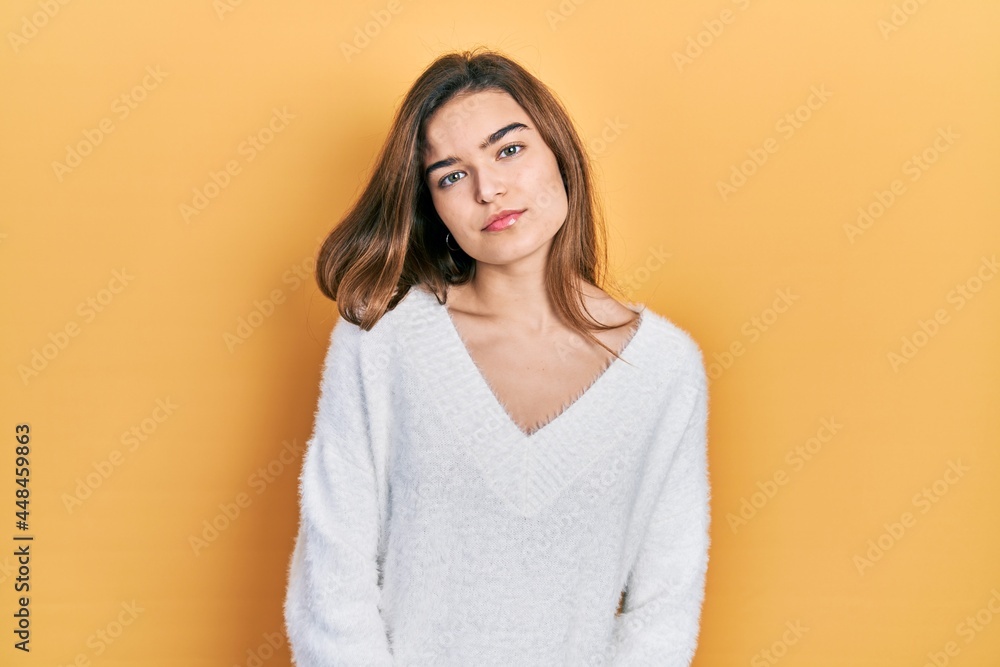 Young caucasian girl wearing casual clothes relaxed with serious expression on face. simple and natural looking at the camera. Young caucasian girl wearing casual clothes relaxed with serious expression on face. simple and natural looking at the camera.