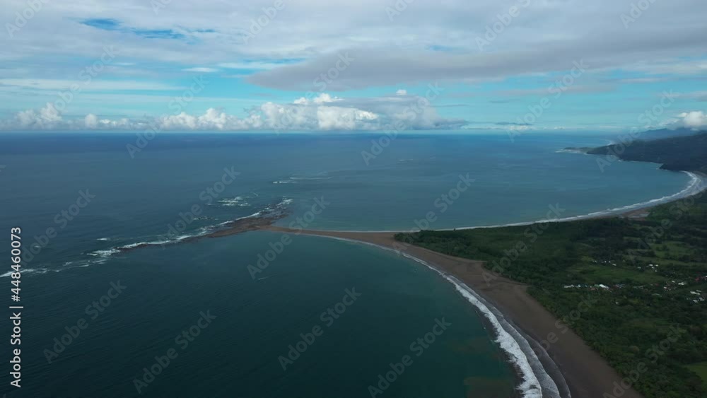 giant rock and sand formation shape of a whale’s tail Uvita Costa Rica aerial 