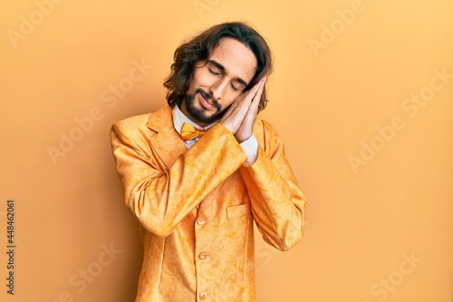 Young hispanic man wearing hipster elegant look sleeping tired dreaming and posing with hands together while smiling with closed eyes.