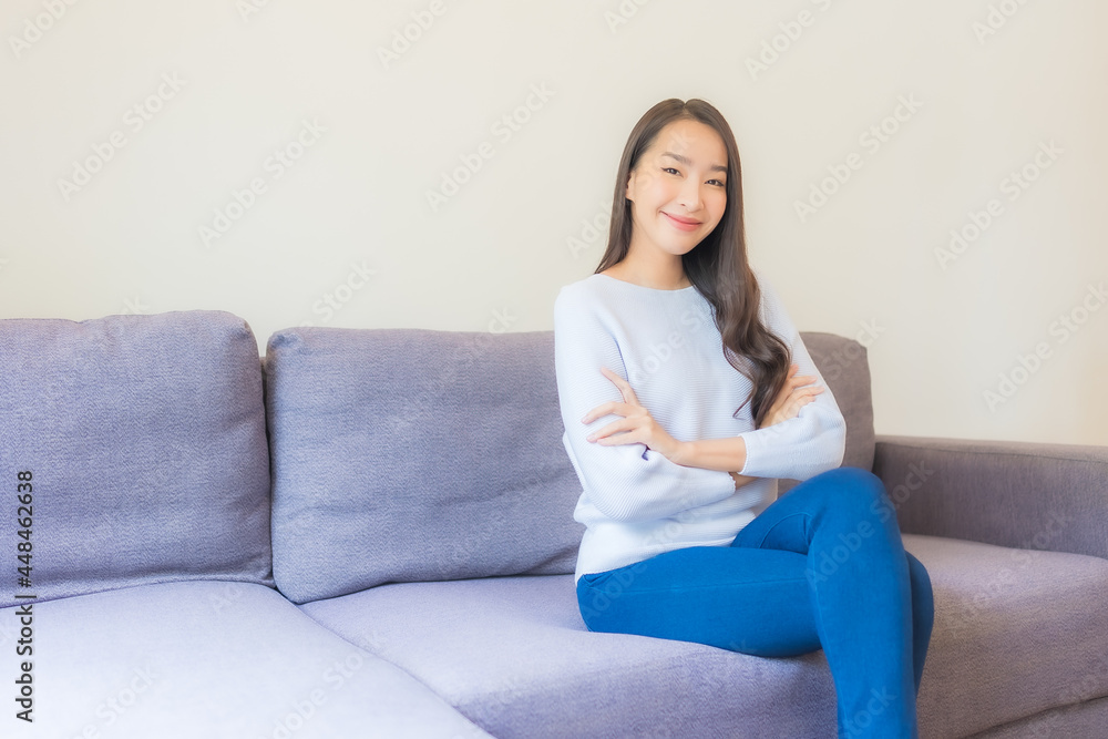 Portrait beautiful young asian woman relax smile on sofa