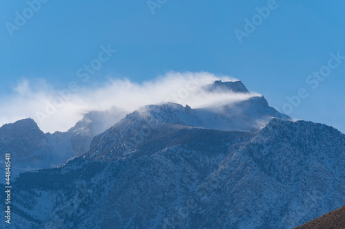 Snow and Wind on mountain peaks  Lone Pine Desert  California