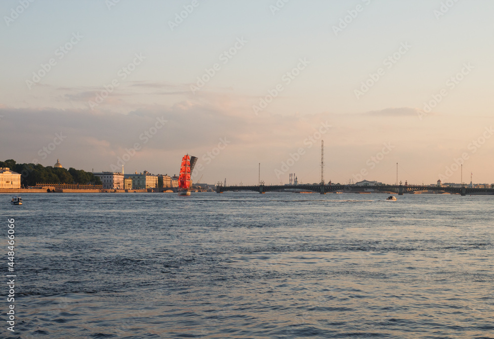 St. Petersburg, Russia. Evening panorama of Neva river.  Scarlet sailboat crossing open Trinity bridge (preparation for 