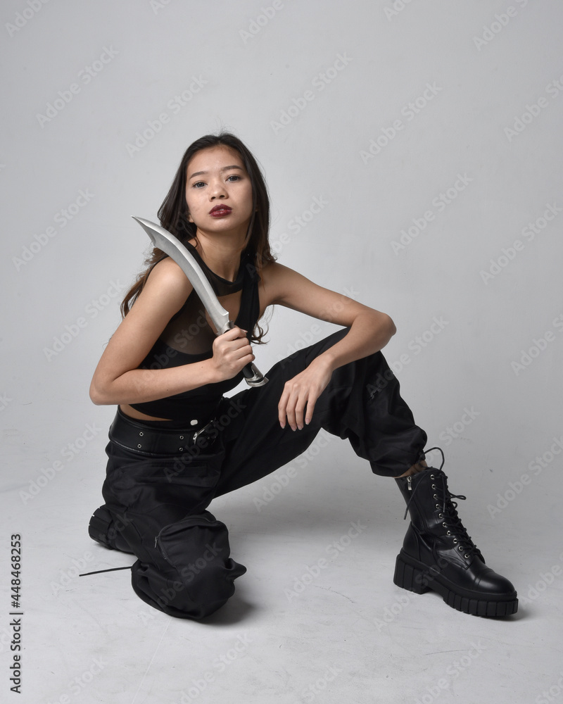 Full length portrait of pretty young asian girl wearing black tank top ...