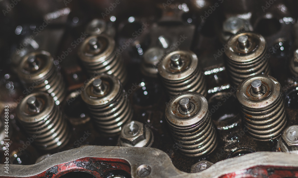 The mechanic is checking the engine. The mechanic is checking the engine.