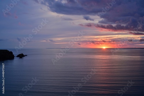 静かな入り江に沈む夕日の情景＠北海道