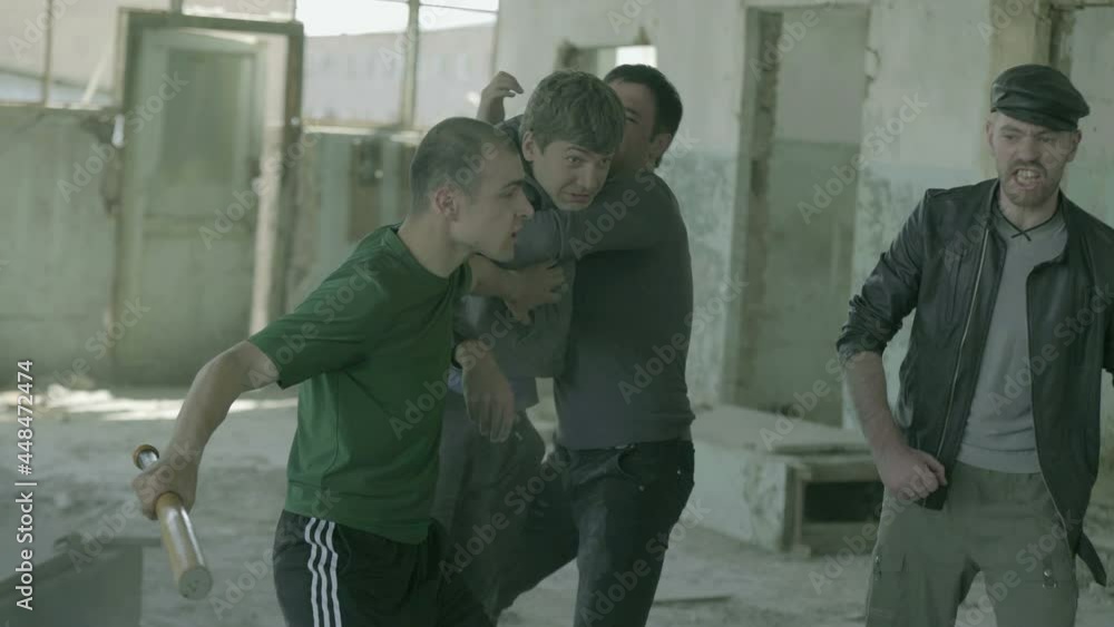 4k Group of men fighting in abandoned building . Friends helping each other during the fight . Drug deal between criminal gangs goes wrong & a fight breaks out . Staged, scenic shot with artists 4k Group of men fighting in abandoned building . Friends helping each other during the fight . Drug deal between criminal gangs goes wrong & a fight breaks out . Staged, scenic shot with artists