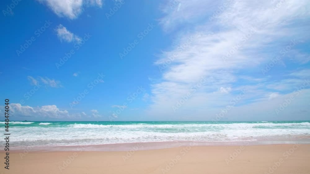 4K Beautiful tropical beach with blue sky and clouds. Tropical beach with waves crashing empty beach. Andaman Phuket beach Thailand. 4K Beautiful tropical beach with blue sky and clouds. Tropical beach with waves crashing empty beach. Andaman Phuket beach Thailand.