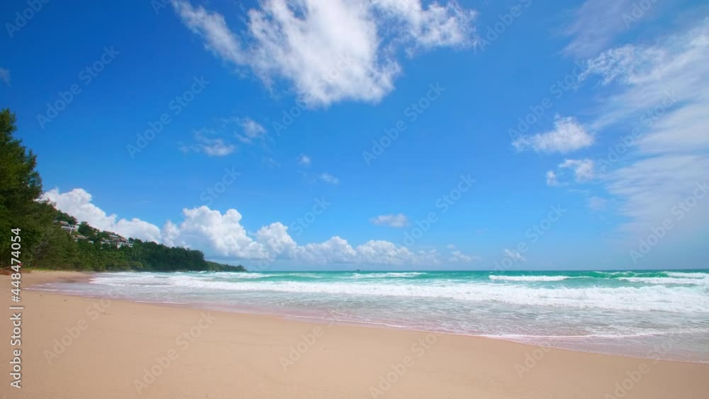 4K Beautiful tropical beach with blue sky and clouds. Tropical beach with waves crashing empty beach. Andaman Phuket beach Thailand. 4K Beautiful tropical beach with blue sky and clouds. Tropical beach with waves crashing empty beach. Andaman Phuket beach Thailand.