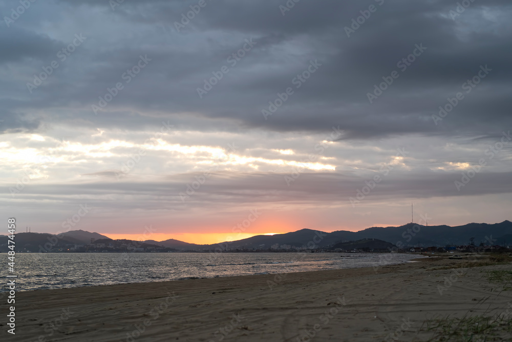 seascape with a beautiful sunset on the background of the sea